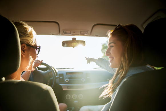 Two women driving a car